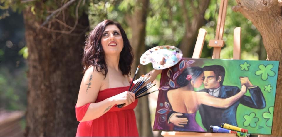 Olga painting outdoors